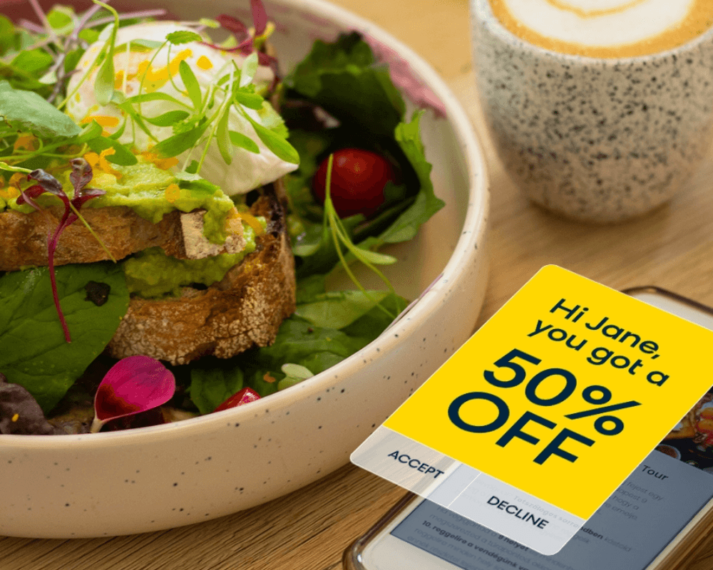 50% offer on mobile phone next to a salad