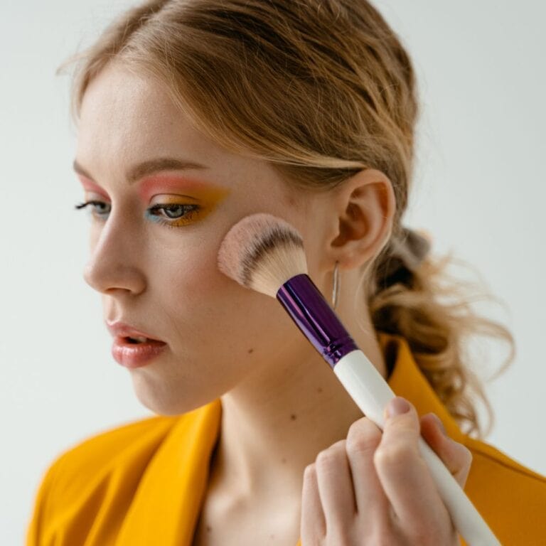 Woman applying makeup