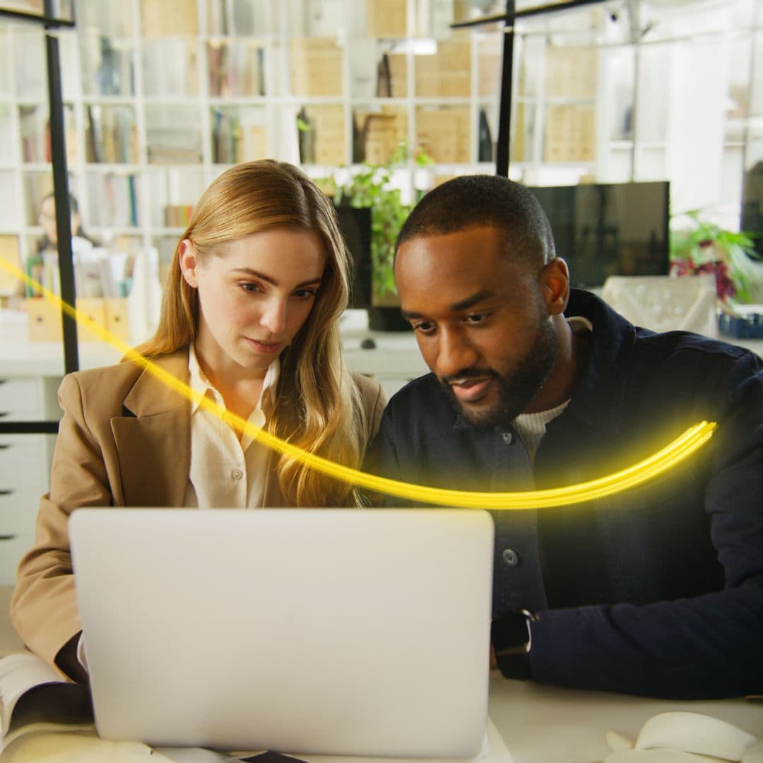 Man and woman sitting at a computer