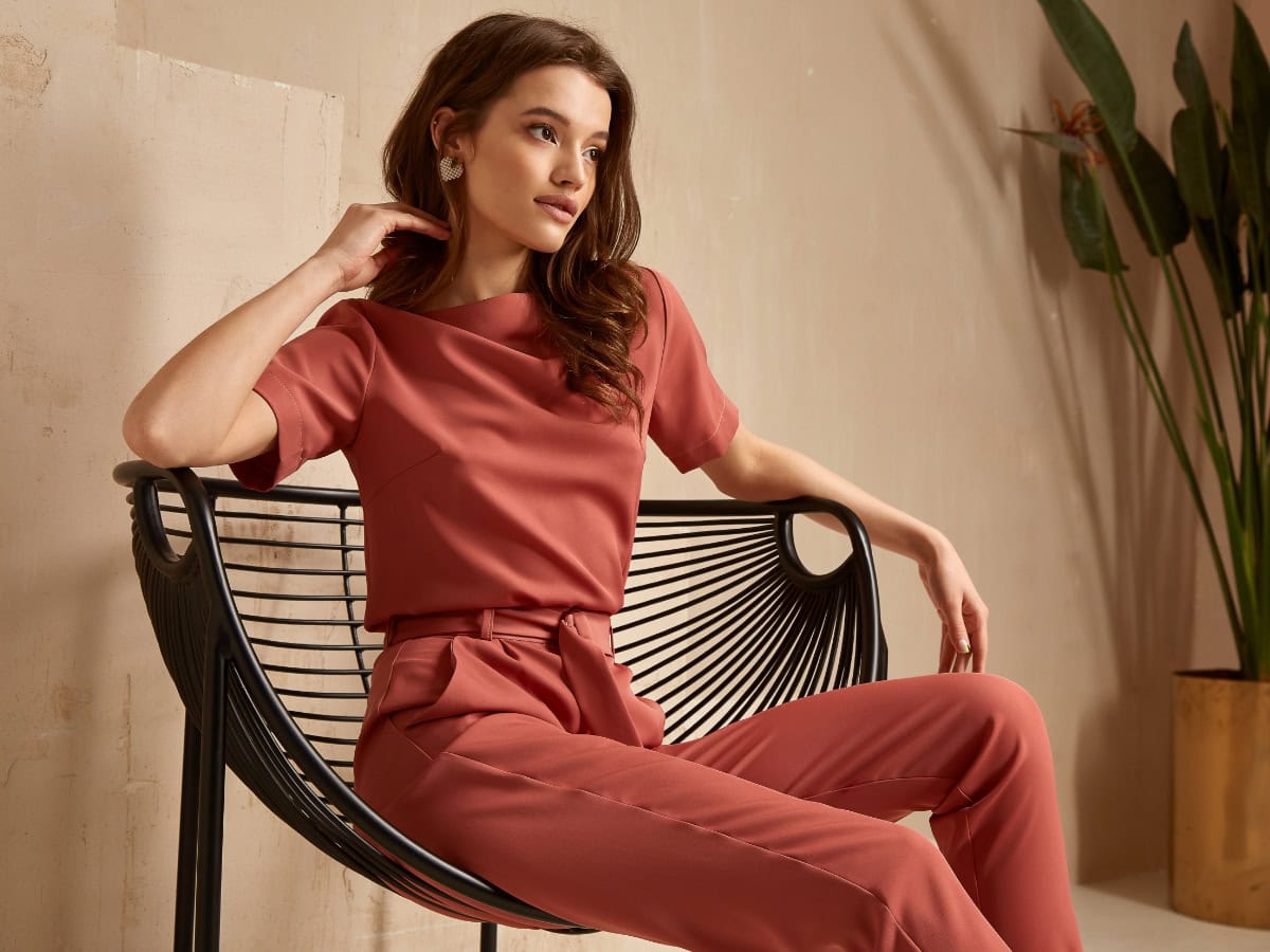 Model sitting in a chair