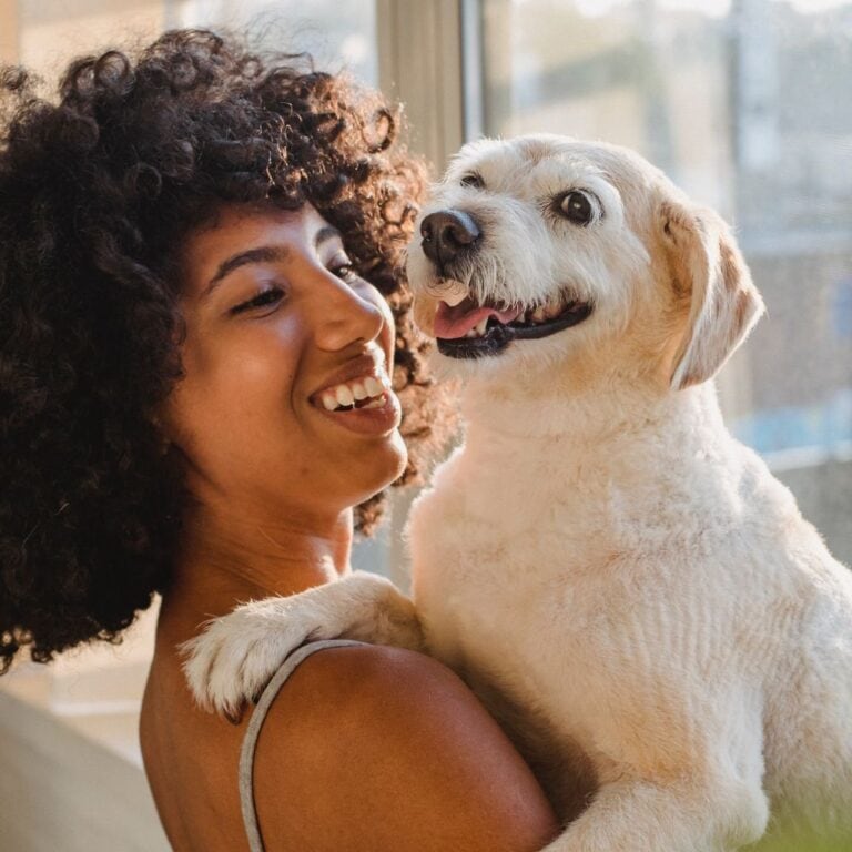 Woman smiling with her dog