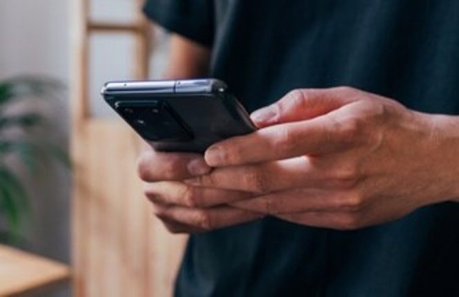 Man holding mobile phone