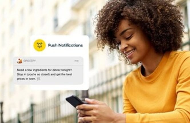 Woman looking at mobile phone and receiving a push notification